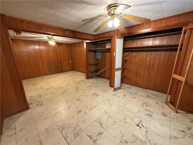 652 Central Ave, Reserve, LA 70084 - unfurnished bedroom with wood walls, multiple closets, and a ceiling fan