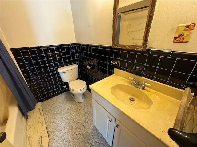 652 Central Ave, Reserve, LA 70084 - bathroom with wainscoting, vanity, and tile walls
