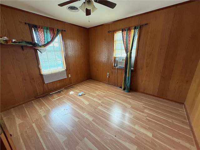 652 Central Ave, Reserve, LA 70084 - unfurnished room with light wood-style flooring, a ceiling fan, cooling unit, and wood walls