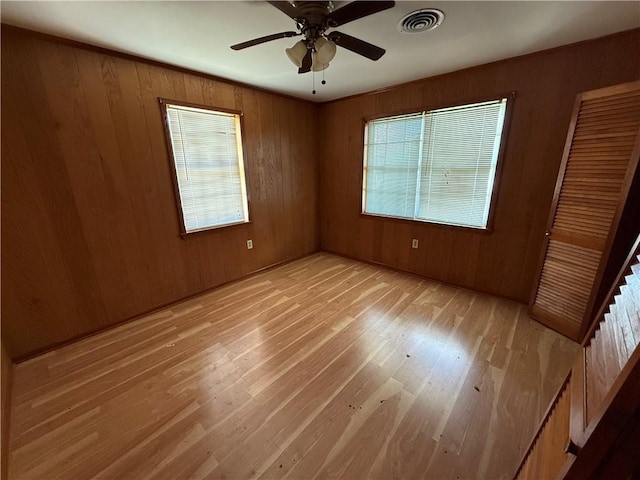 652 Central Ave, Reserve, LA 70084 - unfurnished room featuring light wood-type flooring, a ceiling fan, and wooden walls