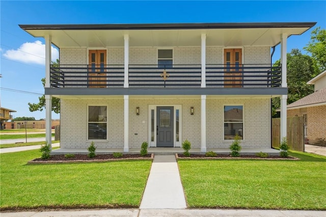 3101 Lake Trail Dr, Metairie, LA 70003 - view of front of house with a balcony, covered porch, and brick siding