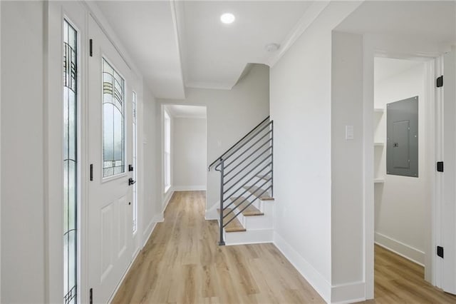 3101 Lake Trail Dr, Metairie, LA 70003 - foyer featuring electric panel, light wood finished floors, ornamental molding, stairway, and recessed lighting