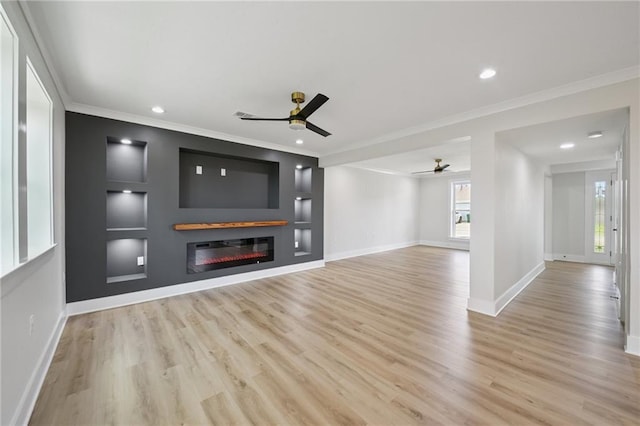 3101 Lake Trail Dr, Metairie, LA 70003 - unfurnished living room featuring a ceiling fan, ornamental molding, wood finished floors, a glass covered fireplace, and recessed lighting