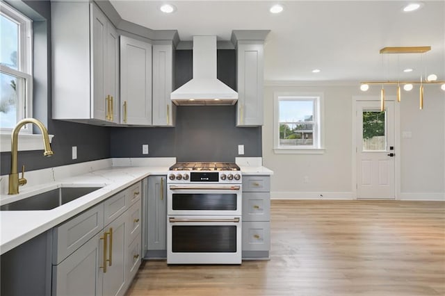 3101 Lake Trail Dr, Metairie, LA 70003 - kitchen featuring premium range hood, range with two ovens, gray cabinets, light wood finished floors, and recessed lighting