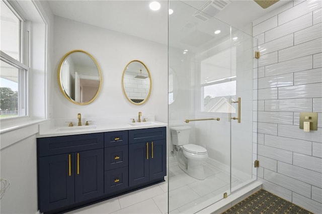 3101 Lake Trail Dr, Metairie, LA 70003 - full bath featuring a shower stall, double vanity, plenty of natural light, tile patterned floors, and recessed lighting