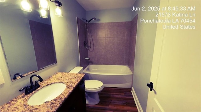 21573 Katina Ln, Ponchatoula, LA 70454 - full bathroom featuring wood finished floors, vanity, and tub / shower combination