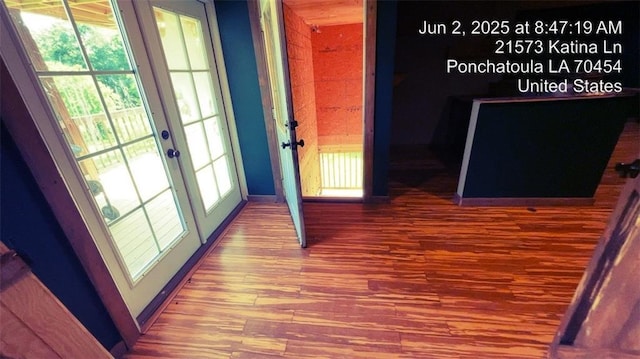 21573 Katina Ln, Ponchatoula, LA 70454 - hallway with french doors and wood finished floors