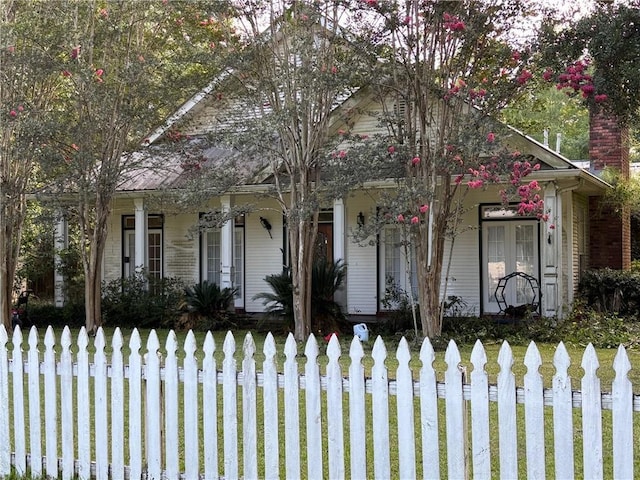 72075 Gum St, Abita Springs, LA 70420 - obstructed view of property with covered porch and a fenced front yard