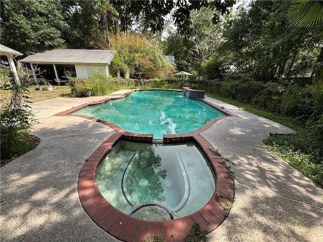 72075 Gum St, Abita Springs, LA 70420 - view of swimming pool with a patio, a pool with connected hot tub, and view of wooded area