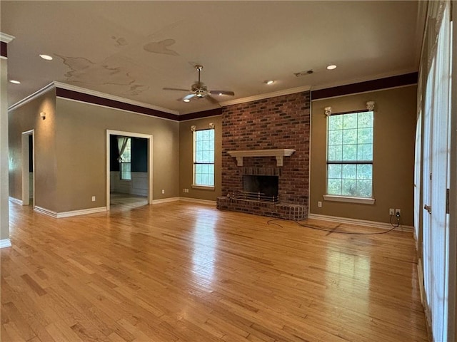 72075 Gum St, Abita Springs, LA 70420 - unfurnished living room featuring ornamental molding, ceiling fan, light wood-type flooring, a fireplace, and recessed lighting