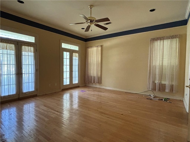 72075 Gum St, Abita Springs, LA 70420 - empty room featuring french doors, ornamental molding, light wood-style floors, and ceiling fan