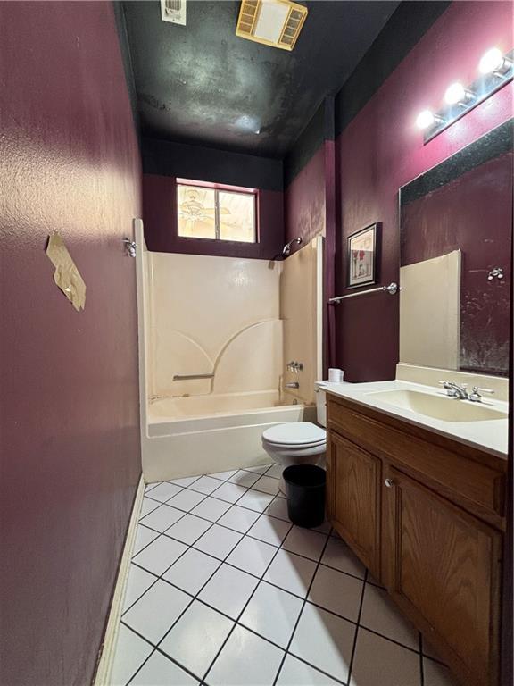 72075 Gum St, Abita Springs, LA 70420 - full bathroom featuring washtub / shower combination, vanity, and tile patterned flooring