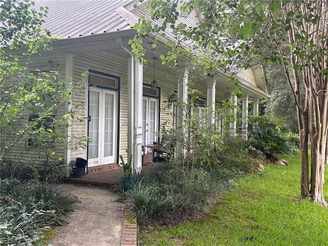 72075 Gum St, Abita Springs, LA 70420 - view of property exterior featuring covered porch and a metal roof