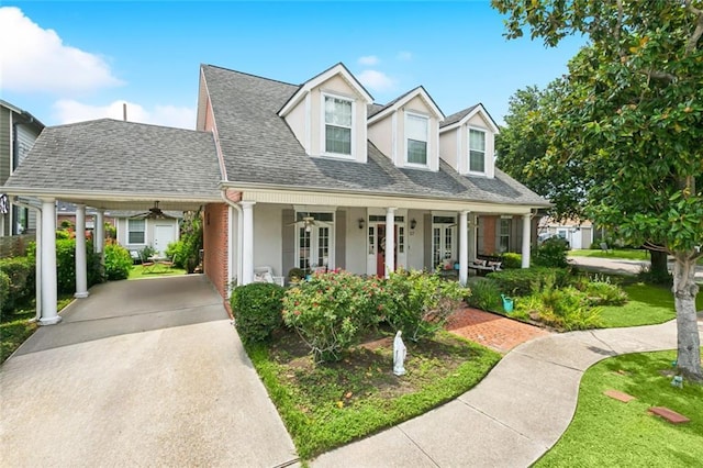 57 Beverly Garden Dr, Metairie, LA 70001 - cape cod home with ceiling fan, driveway, french doors, stucco siding, and a shingled roof