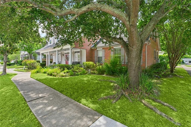 57 Beverly Garden Dr, Metairie, LA 70001 - view of front of home with brick siding and a front lawn