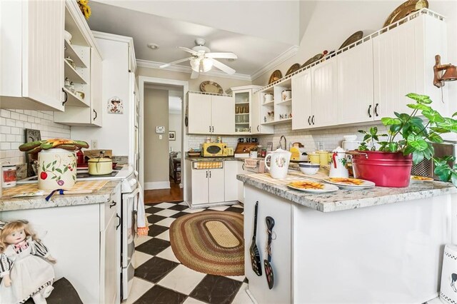 57 Beverly Garden Dr, Metairie, LA 70001 - kitchen featuring light floors, open shelves, a peninsula, a ceiling fan, and light countertops