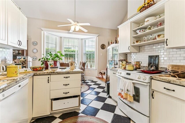 57 Beverly Garden Dr, Metairie, LA 70001 - kitchen featuring white appliances, dark floors, ceiling fan, light countertops, and lofted ceiling
