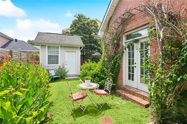 57 Beverly Garden Dr, Metairie, LA 70001 - view of green lawn featuring french doors and a shed