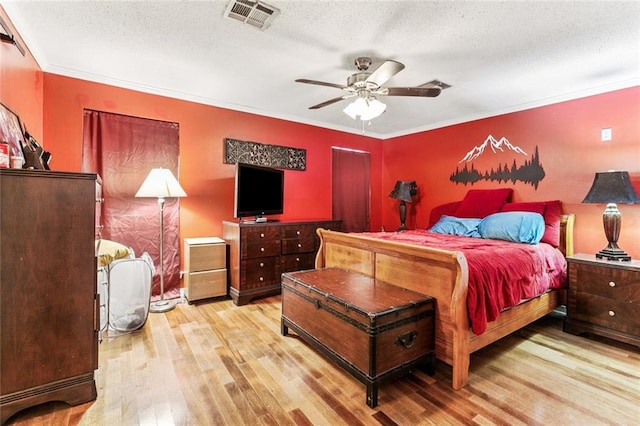1369 Holiday Pl, New Orleans, LA 70114 - bedroom featuring wood finished floors, a textured ceiling, ornamental molding, and ceiling fan