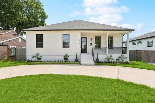 1916 Roosevelt Blvd, Kenner, LA 70062 - view of front facade with covered porch, stucco siding, and a shingled roof