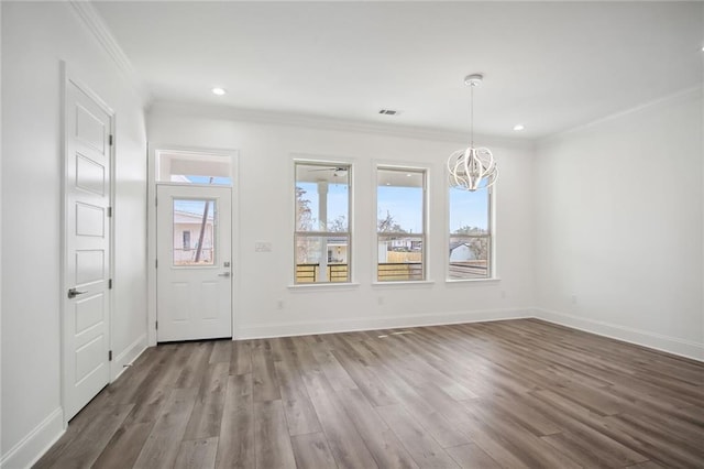 1916 Roosevelt Blvd, Kenner, LA 70062 - foyer entrance with a chandelier, crown molding, wood finished floors, and recessed lighting