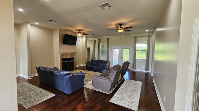 181 Latigue Rd, Avondale, LA 70094 - living area featuring french doors, ceiling fan, dark wood-style floors, a tile fireplace, and recessed lighting