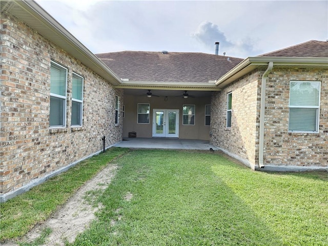 181 Latigue Rd, Avondale, LA 70094 - rear view of property featuring french doors, a lawn, a ceiling fan, a patio, and a shingled roof