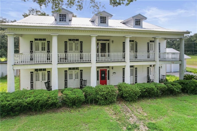 60222 N Bell Rd, Amite, LA 70422 - greek revival house featuring a front yard and french doors