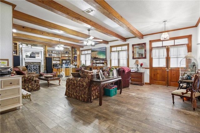 60222 N Bell Rd, Amite, LA 70422 - living room with a ceiling fan, wood-type flooring, beamed ceiling, a fireplace, and a wainscoted wall