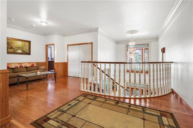60222 N Bell Rd, Amite, LA 70422 - corridor with an upstairs landing, wood finished floors, a wainscoted wall, and crown molding