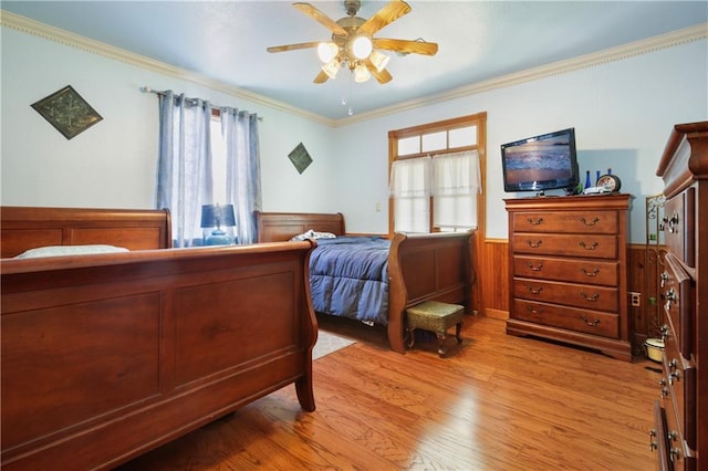 60222 N Bell Rd, Amite, LA 70422 - bedroom featuring light wood finished floors, a wainscoted wall, ornamental molding, and ceiling fan