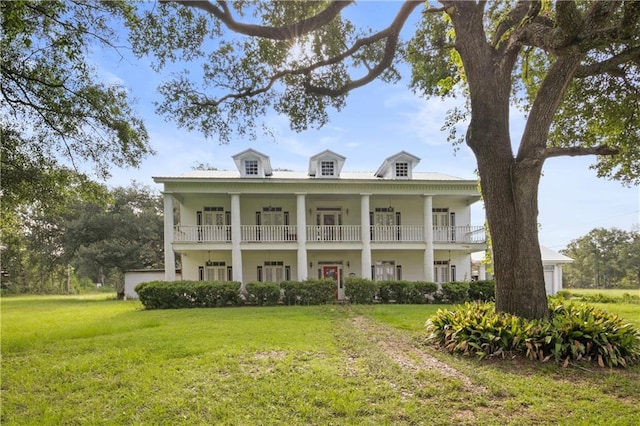 60222 N Bell Rd, Amite, LA 70422 - neoclassical / greek revival house featuring a front lawn and a balcony