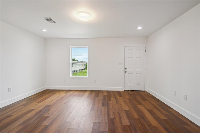 3304 Metropolitan St, New Orleans, LA 70126 - spare room featuring dark wood-style floors and recessed lighting