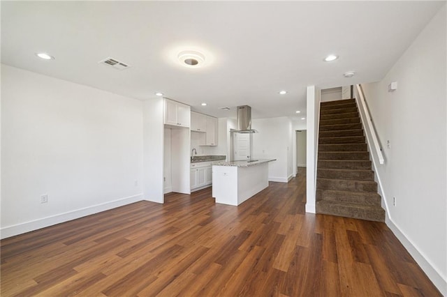3304 Metropolitan St, New Orleans, LA 70126 - unfurnished living room featuring stairway, dark wood-style flooring, and recessed lighting