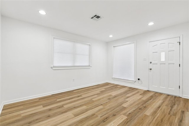 3809 N Woodlawn Ave, Metairie, LA 70006 - foyer entrance with light wood-style flooring and recessed lighting