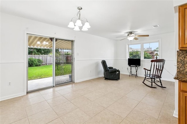 3809 N Woodlawn Ave, Metairie, LA 70006 - sitting room featuring a ceiling fan, a chandelier, and light tile patterned flooring