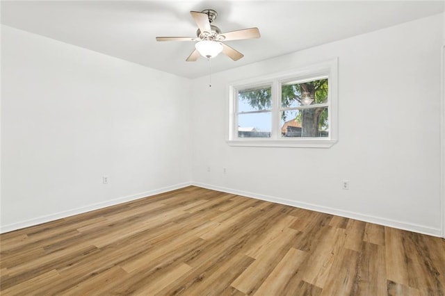 3809 N Woodlawn Ave, Metairie, LA 70006 - unfurnished room with light wood-style floors and a ceiling fan