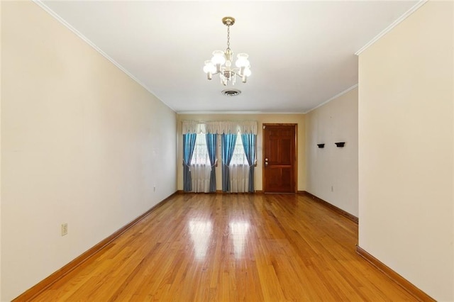 2209 Athania Pkwy, Metairie, LA 70001 - empty room with a chandelier, light wood-type flooring, and ornamental molding