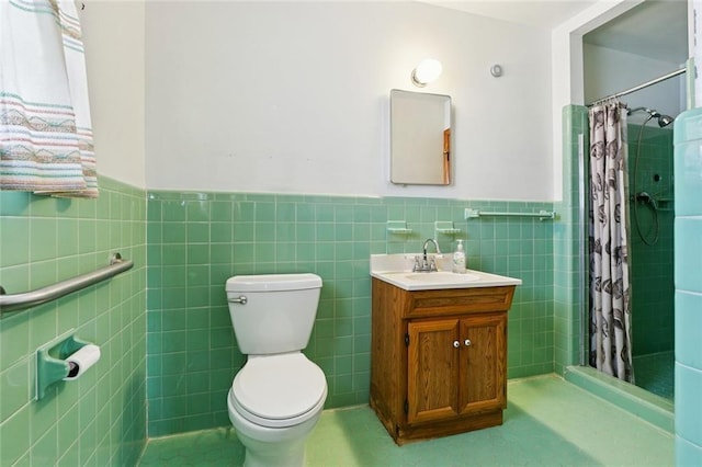 2209 Athania Pkwy, Metairie, LA 70001 - bathroom with tile walls, vanity, a wainscoted wall, and tiled shower
