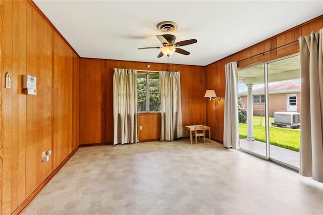 2209 Athania Pkwy, Metairie, LA 70001 - empty room featuring a ceiling fan and wooden walls