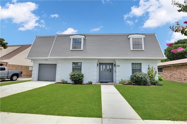 view of front facade with a front lawn, driveway, brick siding, and a garage