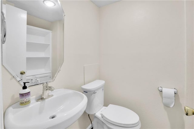 bathroom featuring a sink and toilet