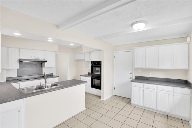 kitchen featuring dark countertops, black appliances, a textured ceiling, beamed ceiling, and under cabinet range hood