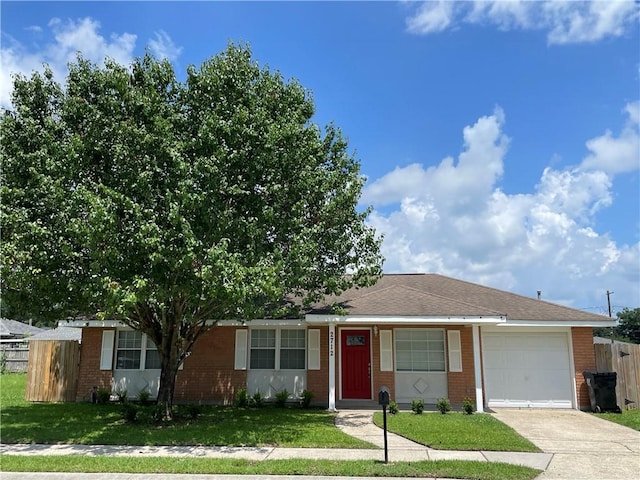 2712 Dauterive Dr, Chalmette, LA 70043 - ranch-style house featuring an attached garage, brick siding, and driveway