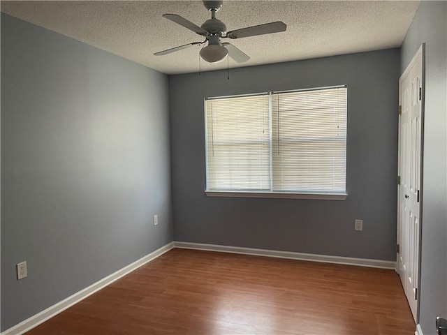 2712 Dauterive Dr, Chalmette, LA 70043 - spare room featuring wood finished floors, ceiling fan, and a textured ceiling