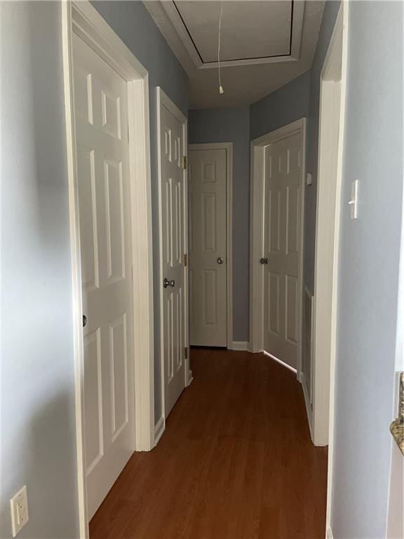 2712 Dauterive Dr, Chalmette, LA 70043 - hallway featuring attic access and dark wood finished floors