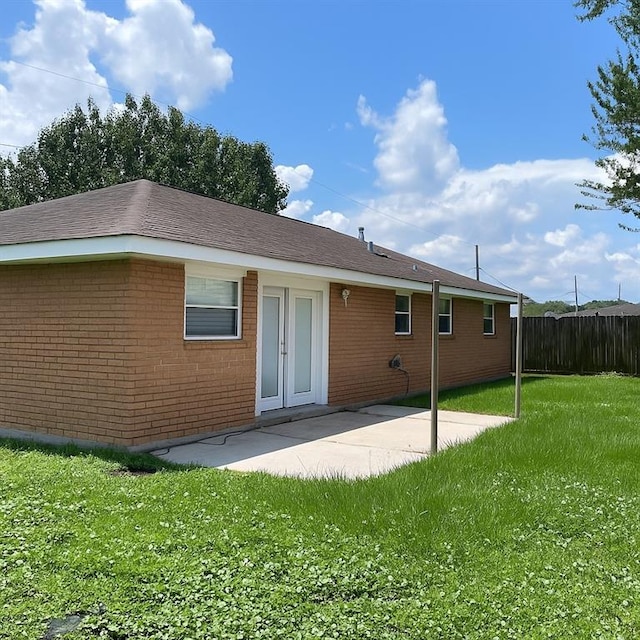 2712 Dauterive Dr, Chalmette, LA 70043 - rear view of property featuring a patio area and brick siding