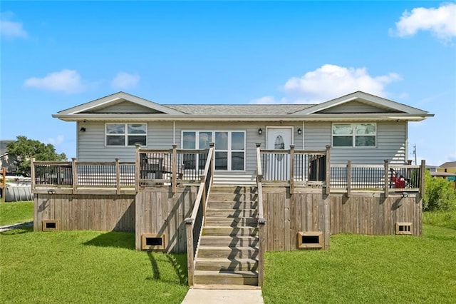 243 Carr Dr, Slidell, LA 70458 - back of property featuring a wooden deck, a yard, stairway, and a shingled roof