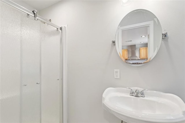243 Carr Dr, Slidell, LA 70458 - bathroom featuring a sink and a shower stall