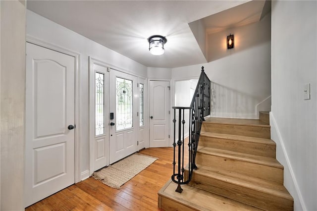 4043 S Inwood Ave, New Orleans, LA 70131 - foyer entrance featuring stairway and light wood-style flooring